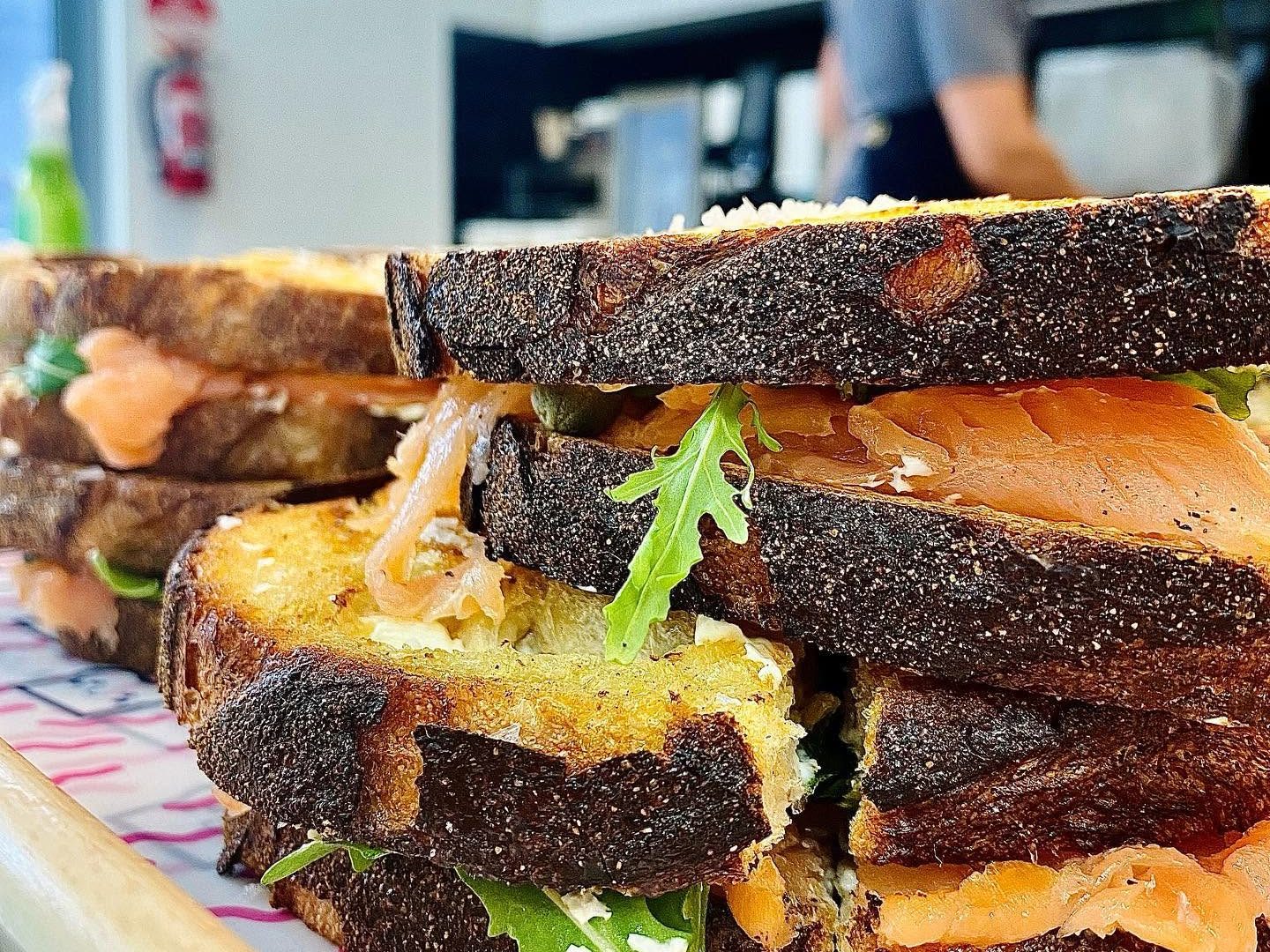 * TOAST IT! * ____________________________________________ TWO CAFES. ONE SIGNATURE.ONE BRAND.____________________________________ ICONIC TOASTIES & SPECIALTY COFFEE.