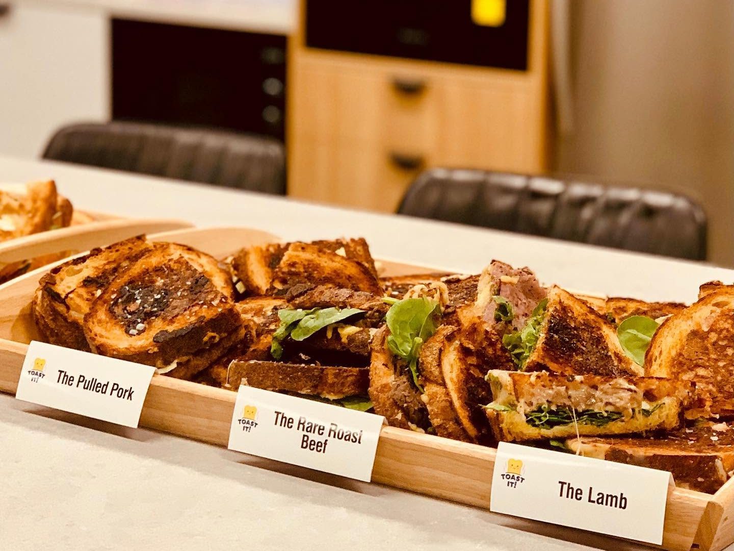 * TOAST IT! * ____________________________________________ TWO CAFES. ONE SIGNATURE.ONE BRAND.____________________________________ ICONIC TOASTIES & SPECIALTY COFFEE.