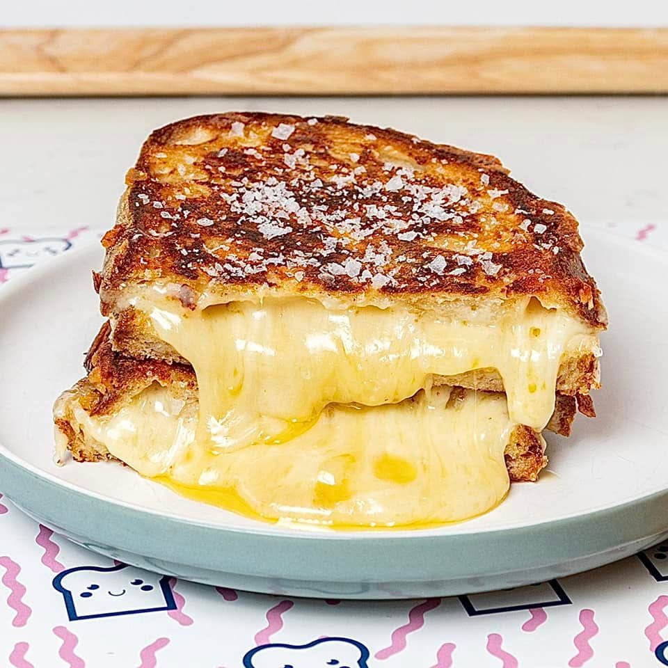 * TOAST IT! * ____________________________________________ TWO CAFES. ONE SIGNATURE.ONE BRAND.____________________________________ ICONIC TOASTIES & SPECIALTY COFFEE.